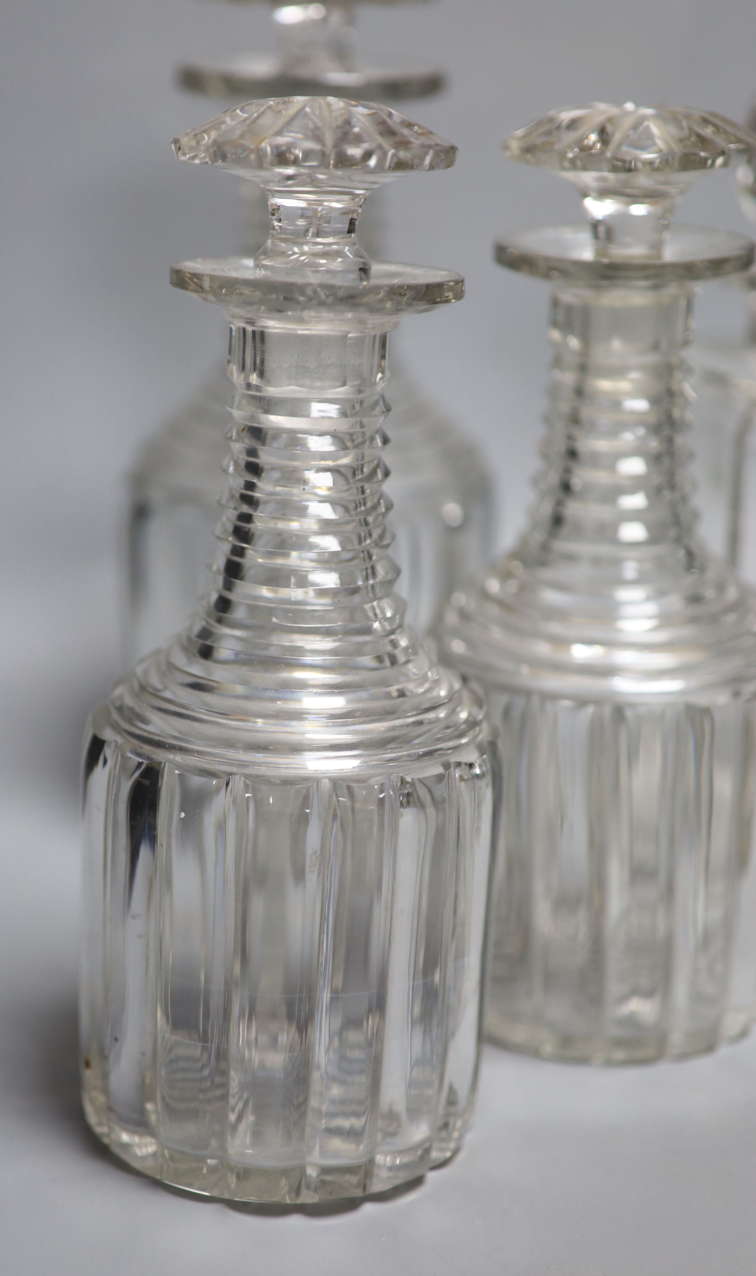 A set of four glass decanters, a matching pair and another, 25cm